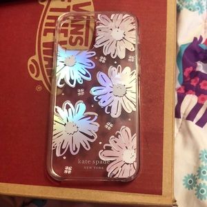 shimmery daisies with gems around the case